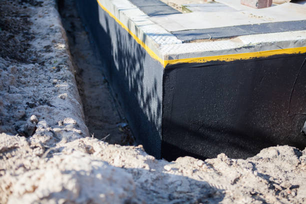 Professional Waterproofing technician working in Gregory, MI